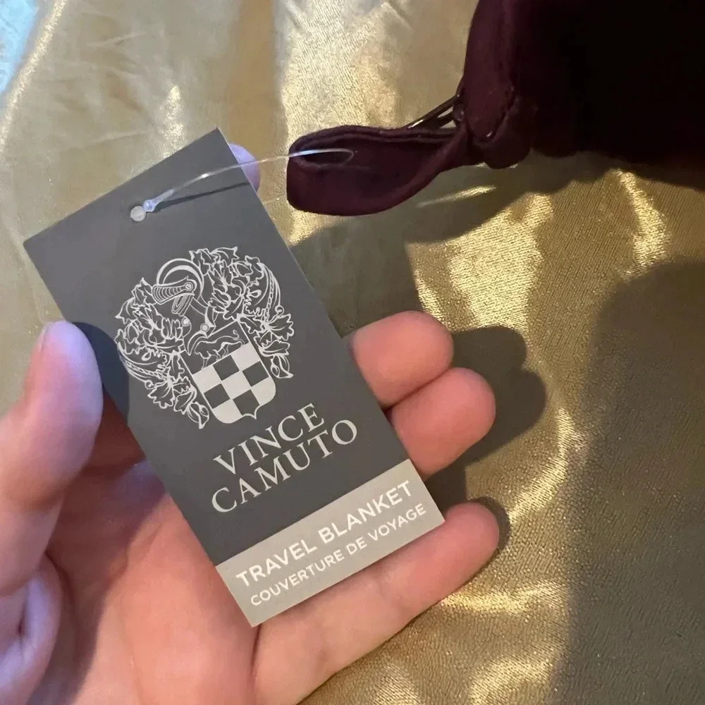 Vince camuto travel blanket with zipper storage bag.